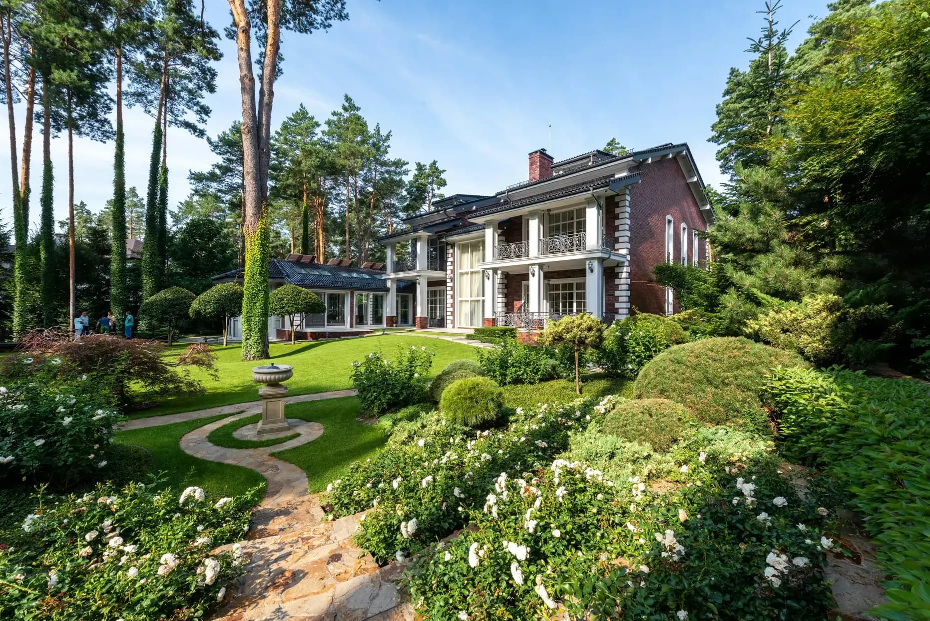 Country Club of the South style estate with manicured gardens in Johns Creek Georgia