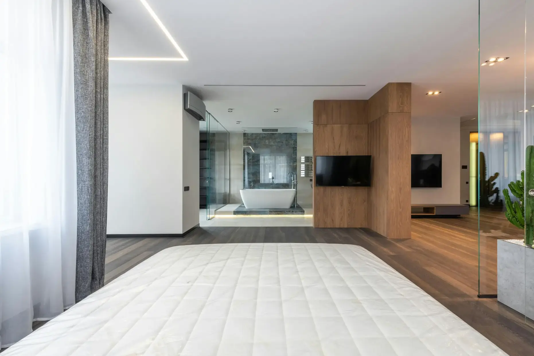 Luxury master suite with custom closet and dressing area in Atlanta home