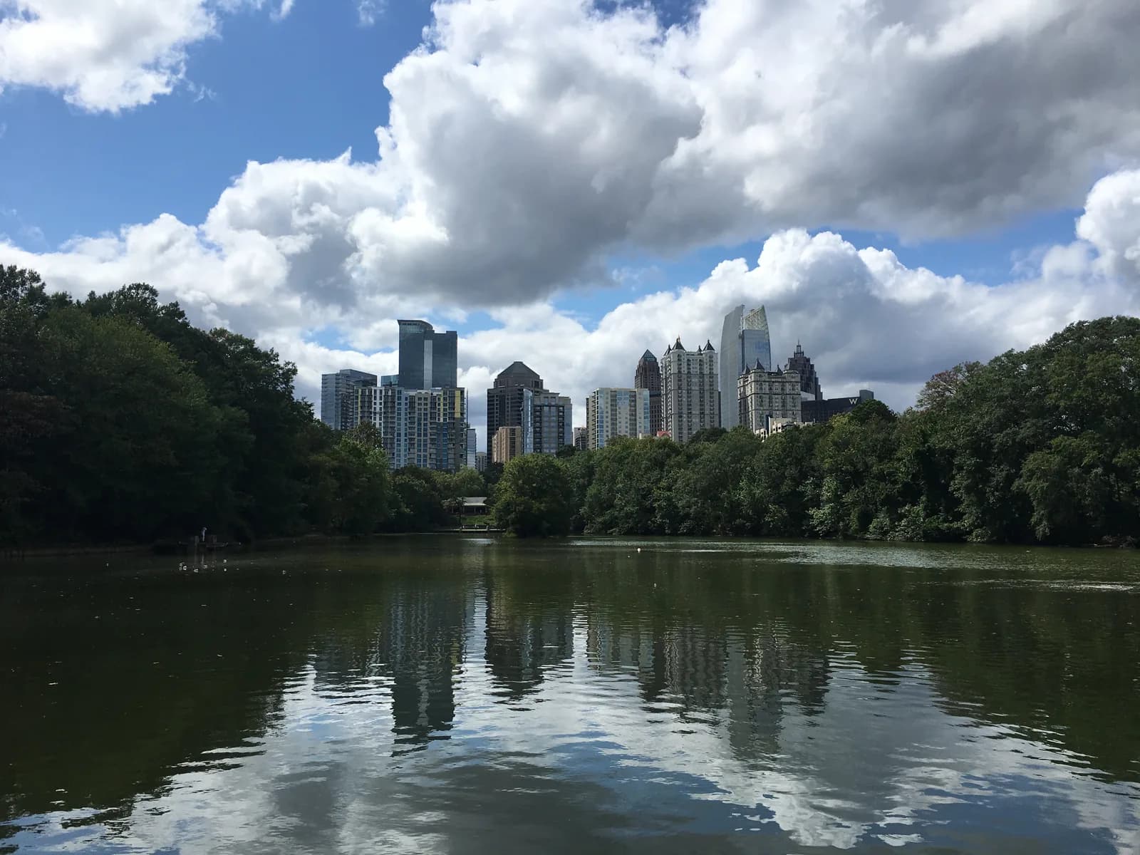 Lake Clara Meer in Piedmont Park with the Midtown Atlanta skyline reflected in the water