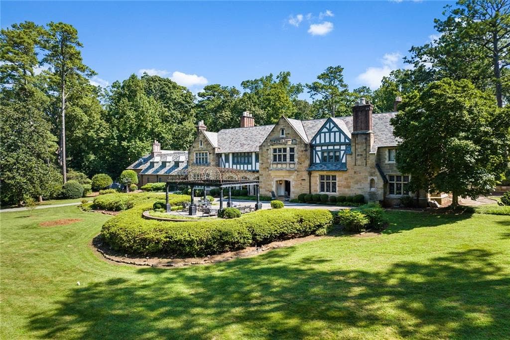 Valley Road Buckhead Tudor stone estate aerial view with circular driveway and gazebo